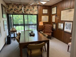 Kendall Page Conference Room Conference room with leather wingback chairs and globe at Kendall Page Attorney office