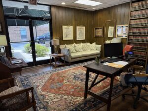Kendall Page Law Office Reception Reception area at Kendall Page Attorney office in Chapel Hill with law books and comfortable seating